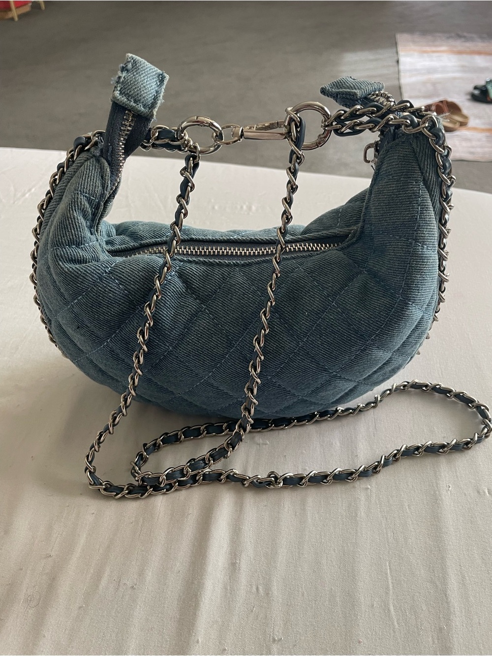 Madison West Quilted Crescent Mini denim handbag